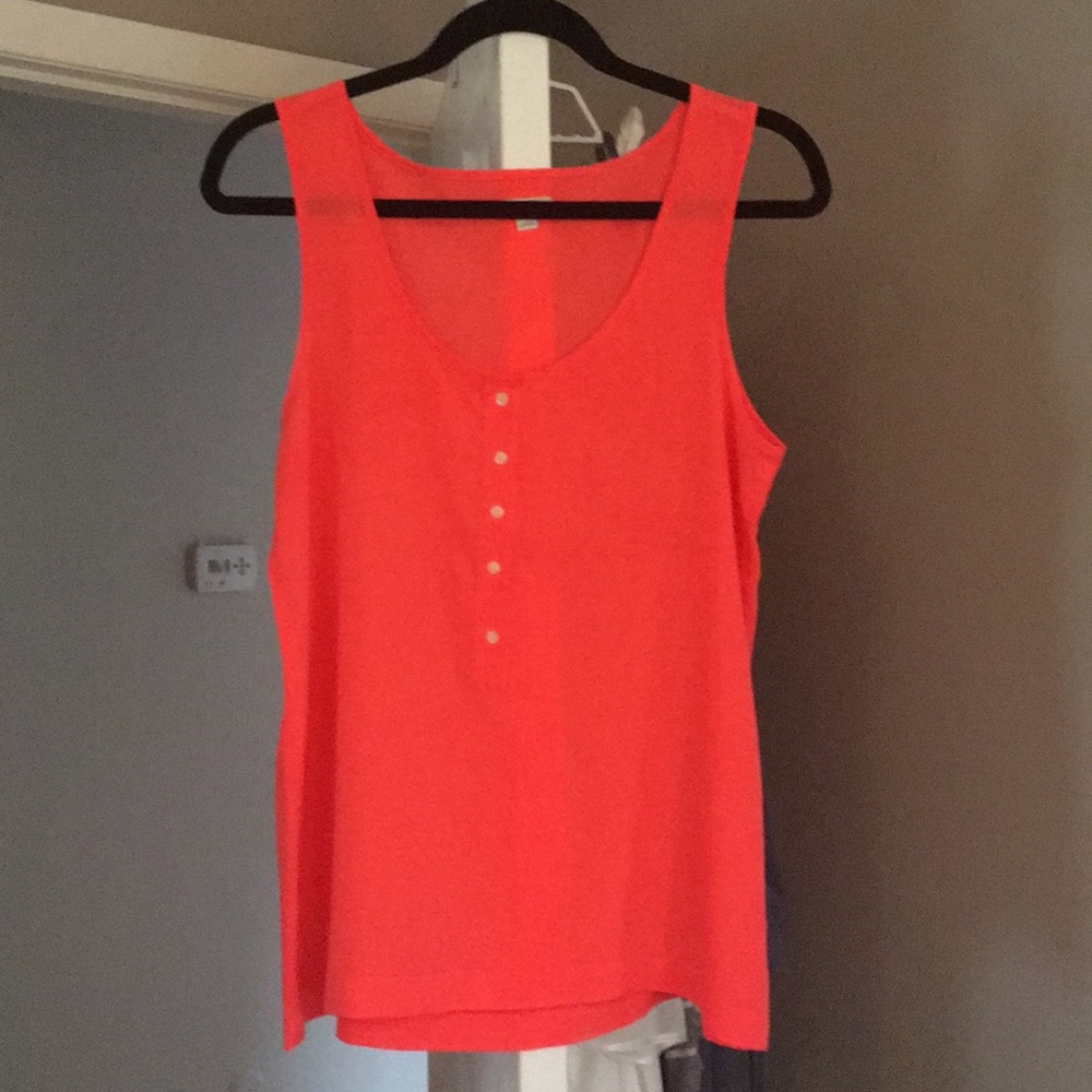 Loose fitting, neon sleeveless tank.